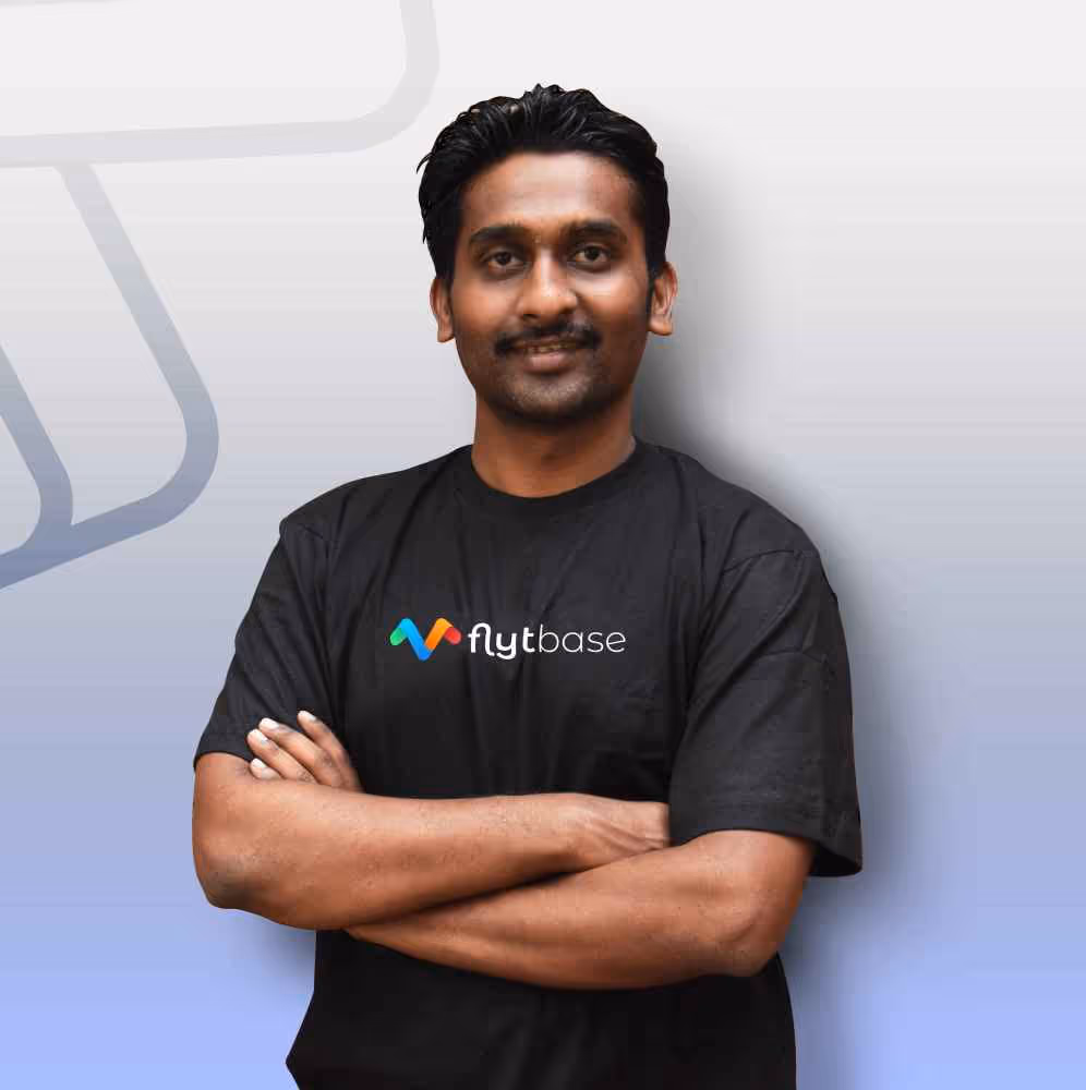 Dhiraj Dhule, Director of Products at FlytBase, in a black shirt with the FlytBase logo.