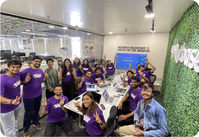 FlytBase team celebrating a milestone with peace signs.