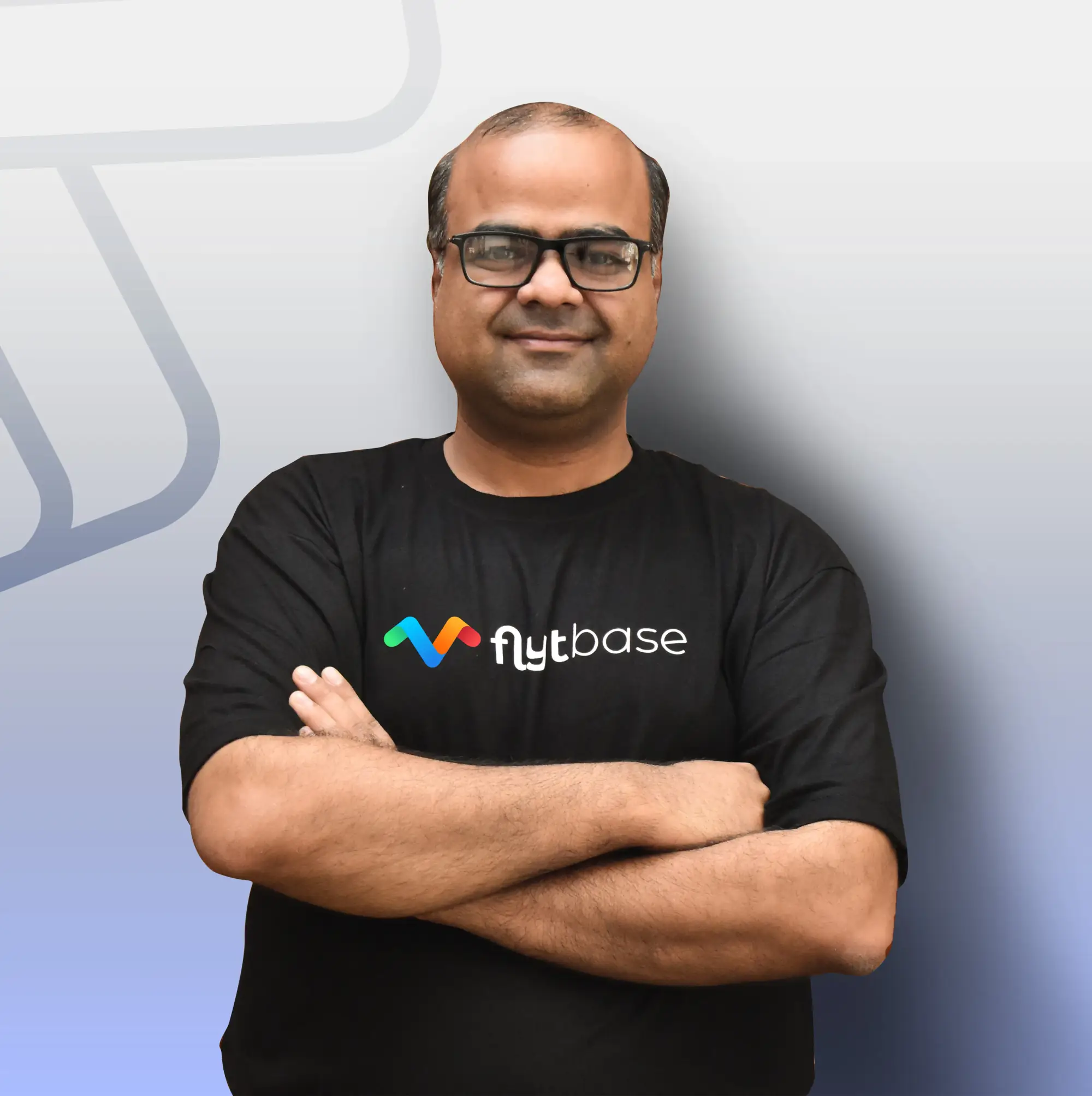 Nitin Gupta, Founder and CEO of FlytBase, in a FlytBase t-shirt with arms crossed.